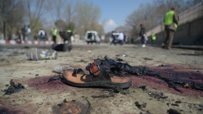 A photo of the aftermath of a suicide bomb in Kabul last month taken by AFP's Shah Marai who died on Monday