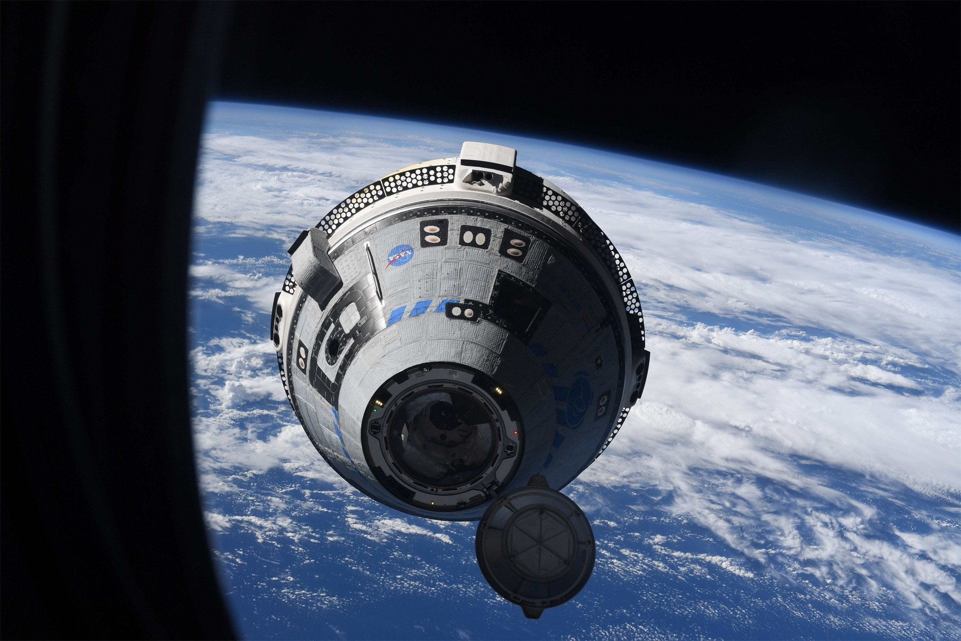 Boeing's Starliner OFT-2 spacecraft approaches the International Space Station in this stunning photo by European Space Agency astronaut Samantha Cristoforetti.