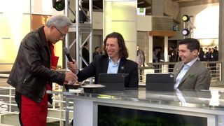 Nvidia CEO Jensen Huang delivering pancakes and sausages to pre-GTC show hosts and guests, wearing an apron