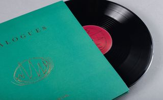 Musical record half way inside green record cover