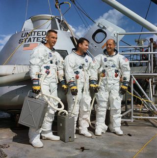 The crew of the Apollo 10 space mission. Left to right are Eugene A. Cernan, lunar module pilot; John W. Young, command module pilot; and Thomas P. Stafford, commander.