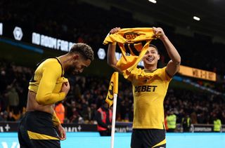 Matheus Cunha of Wolverhampton Wanderers celebrates scoring his team's second goal with teammate Andre during the Premier League match between Wolverhampton Wanderers FC and Aston Villa FC at Molineux on February 01, 2025 in Wolverhampton, England.