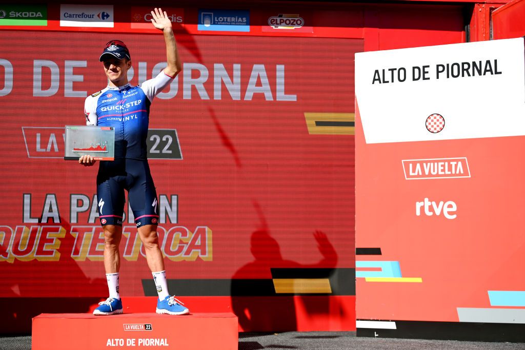 ALTO DEL PIORNAL SPAIN SEPTEMBER 08 Remco Evenepoel of Belgium and Team QuickStep Alpha Vinyl celebrates winning the stage on the podium ceremony after the 77th Tour of Spain 2022 Stage 18 a 192km stage from Trujillo to Alto del Piornal 1163m LaVuelta22 WorldTour on September 08 2022 in Alto del Piornal Caceres Spain Photo by Justin SetterfieldGetty Images