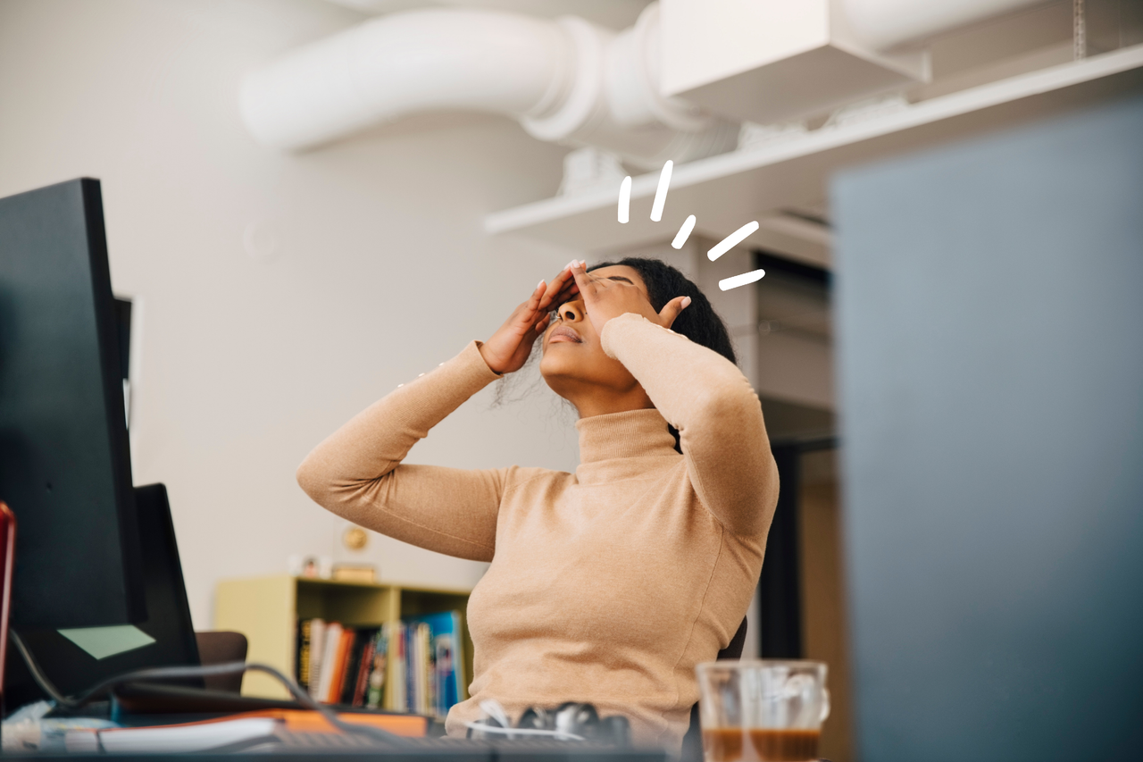 Woman sitting in an office, tired after not having enough sleep