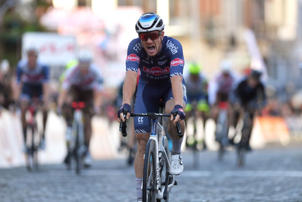 BINCHE BELGIUM OCTOBER 05 Lionel Taminiaux of Belgium and Team AlpecinFenix crosses the finishing line during the 33rd Binche Chimay Binche Memorial Frank Vandenbroucke 2021 a 1986km race from Binche to Binche BincheChimayBinche on October 05 2021 in Binche Belgium Photo by Luc ClaessenGetty Images