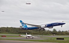 EVERETT, WA - SEPTEMBER 17:Flanked by a pair of chase planes a Boeing 787-9 Dreamliner lifts off for its first flight September 17, 2013 at Paine Field in Everett, Washington. The 787-9 is tw
