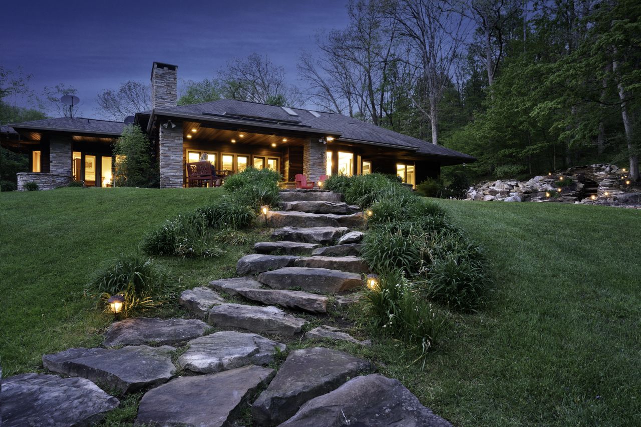 Backside exterior of a Prairie Style house illuminated at night, Farmington, Pennnsylvania, USA