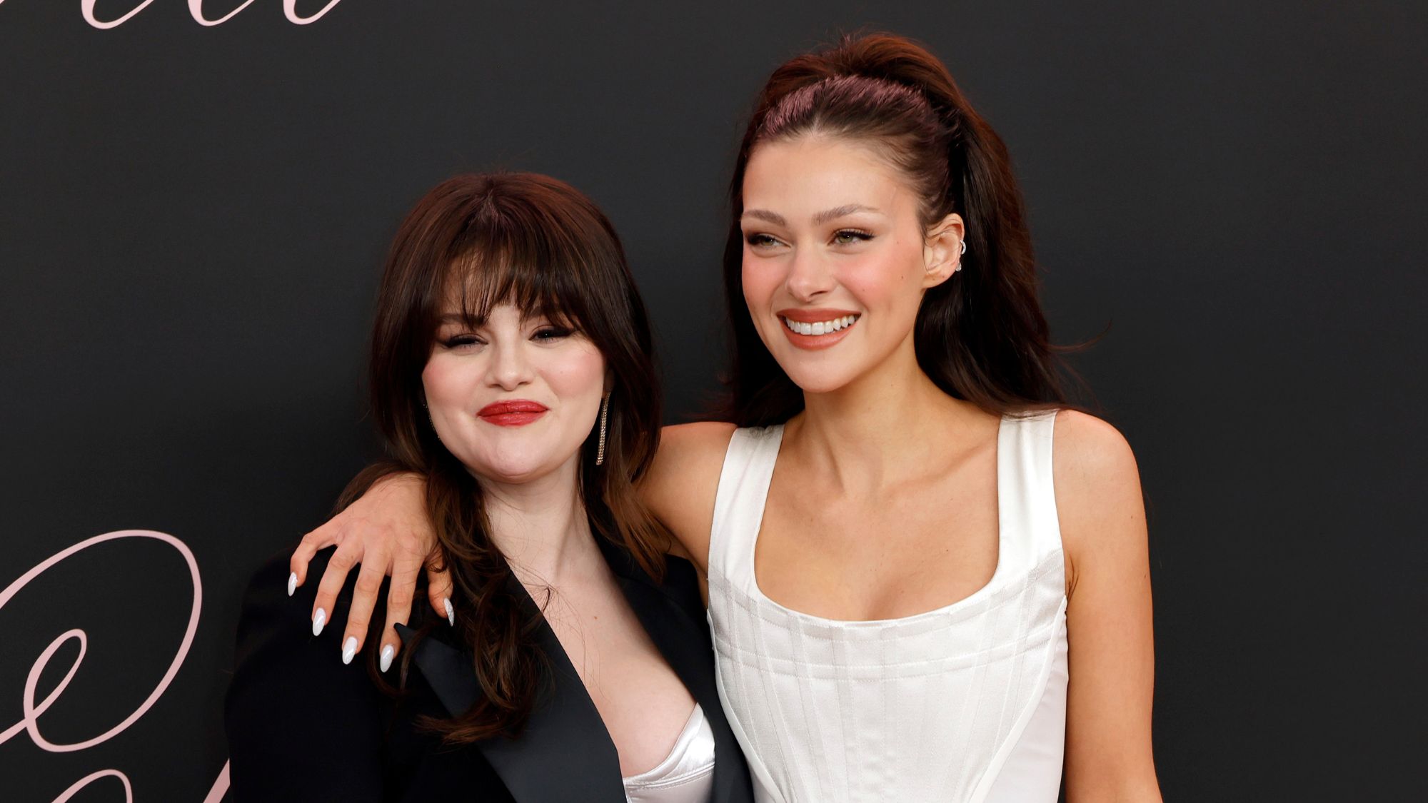 Selena Gomez and Nicola Peltz attend the premiere of Lola