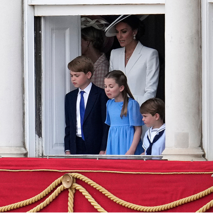 Britain's Catherine, Duchess of Cambridge stands with her children Britain's Prince George of Cambridge, Britain's Princess Charlotte of Cambridge and Britain's Prince Louis of Cambridge watch overlooking Horse Guards as the troops march past during the Queen's Birthday Parade, the Trooping the Colour, as part of Queen Elizabeth II's platinum jubilee celebrations, in London on June 2, 2022. - Huge crowds converged on central London in bright sunshine on Thursday for the start of four days of public events to mark Queen Elizabeth II's historic Platinum Jubilee, in what could be the last major public event of her long reign.