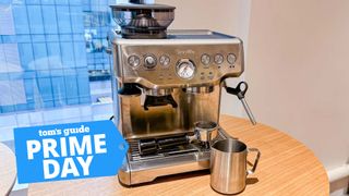 The Barista Express on a table with a milk pitcher, and a Tom's Guide Prime Day badge superimposed
