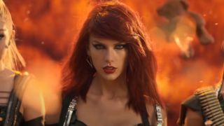 Taylor Swift walking away from an explosion in the Bad Blood video