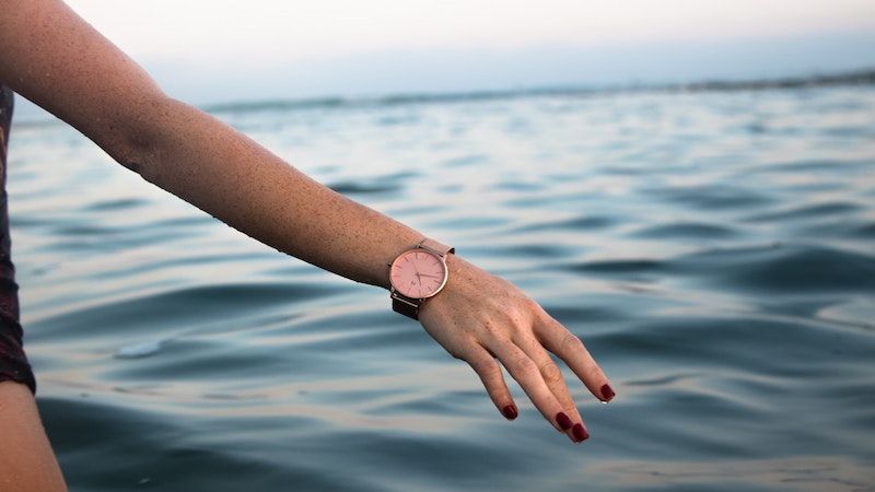 woman wearing watch on beach