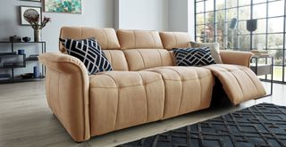 tan colored reclining sofa in a contemporary living room to show a popular sofa trend 2023 for smart designs