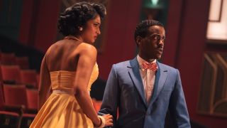 Bel and The Doctor looking worried as they stand in an auditorium in Doctor Who season 2 episode 2 'Lux'