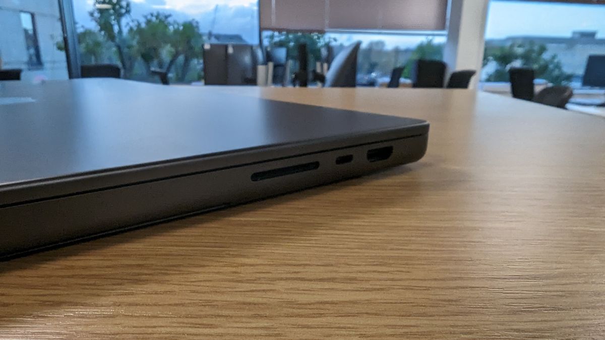 MacBook Pro 16-inch with screen open in an office