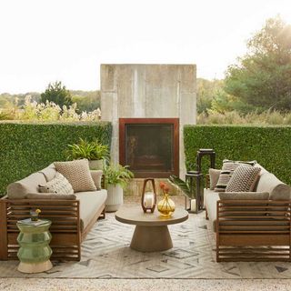 outdoor living area with contemporary furniture and a n outdoor rug to get the quiet luxury garden trend