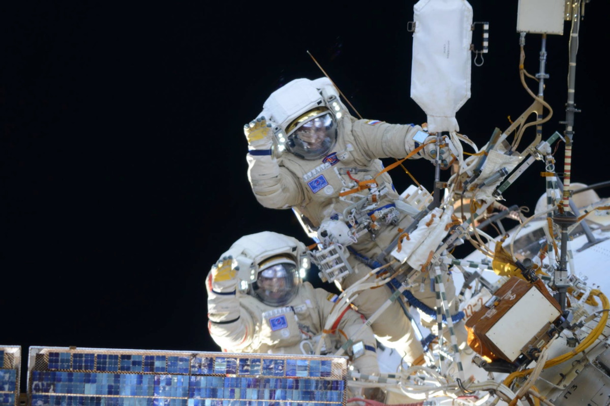 Cosmonauts Wave During Spacewalk