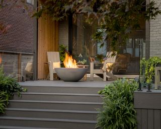 a firepit on a raised deck