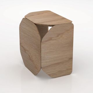 A wood stool made up of wood box sides and top.