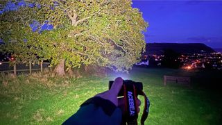 AceBeam H50 2.0 Headlamp lighting up tree