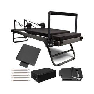 Best at home Reformer Pilates machines: A woman on a Reformer