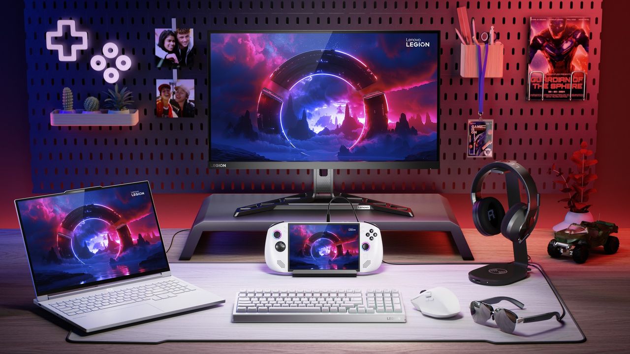 The Lenovo Legion Go S in a dock on a desk, surrounded by other Lenovo Legion hardware and accessories.