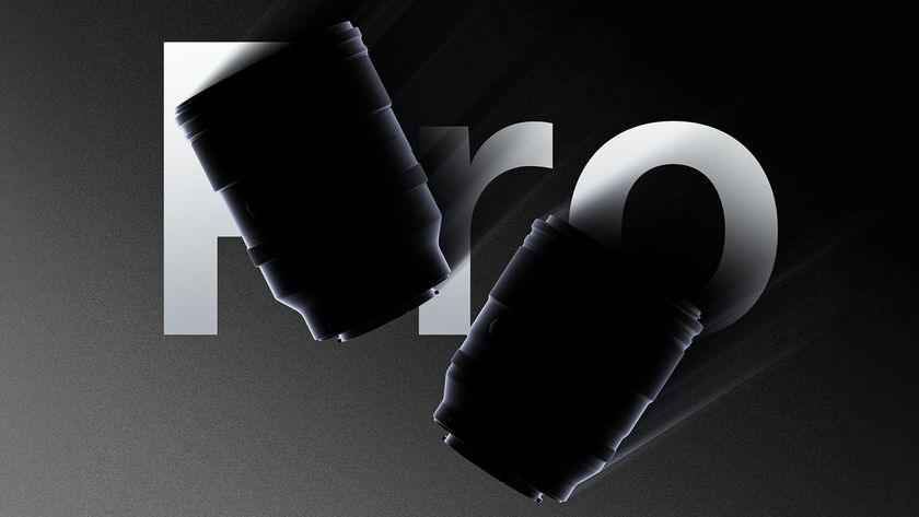 Two camera lenses silhouetted against a dark background, with a stylized &quot;Pro&quot; text design element integrated into the scene