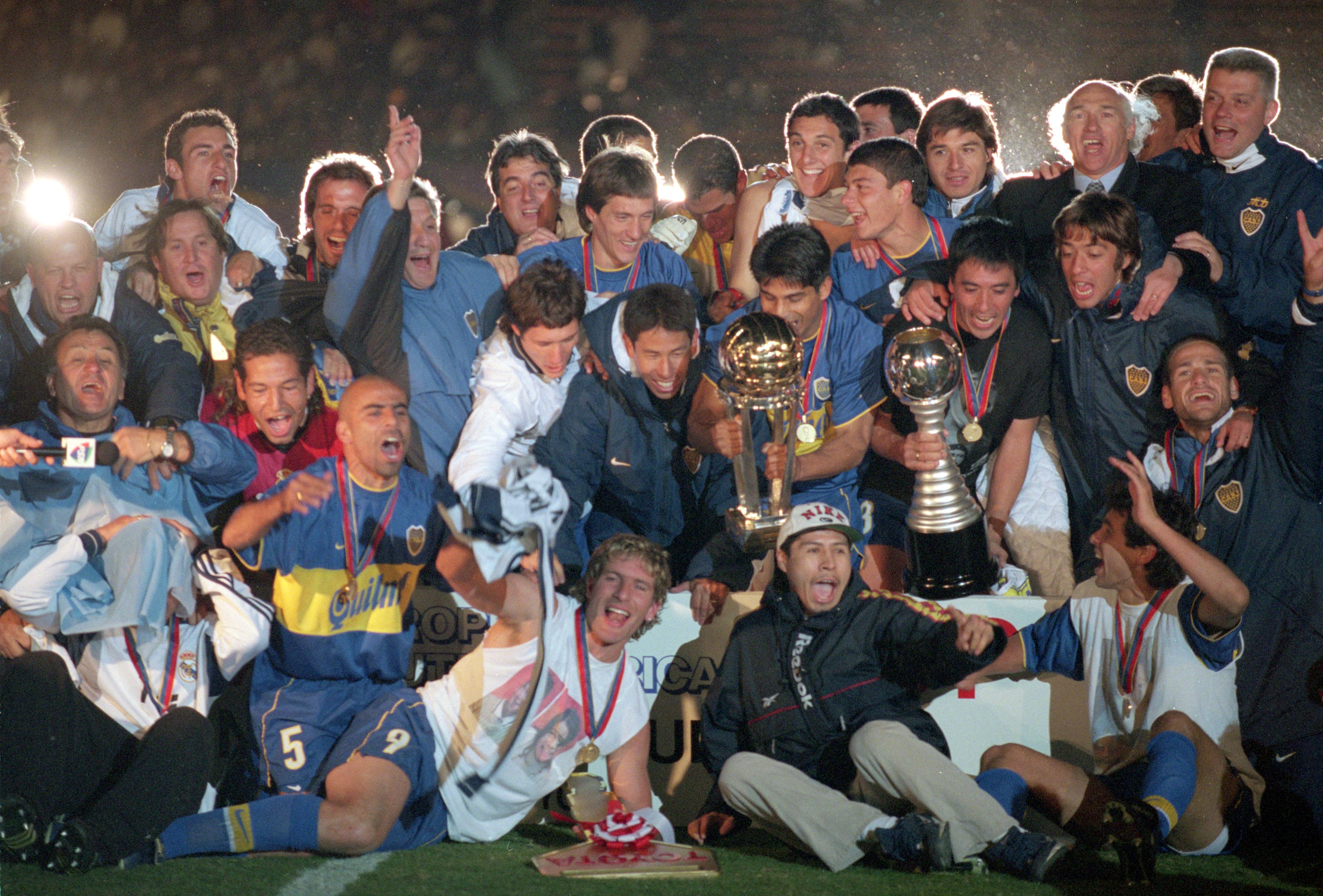 Boca Juniors players celebrate with the Intercontinental Cup after victory over Real Madrid in Tokyo in November 2000.