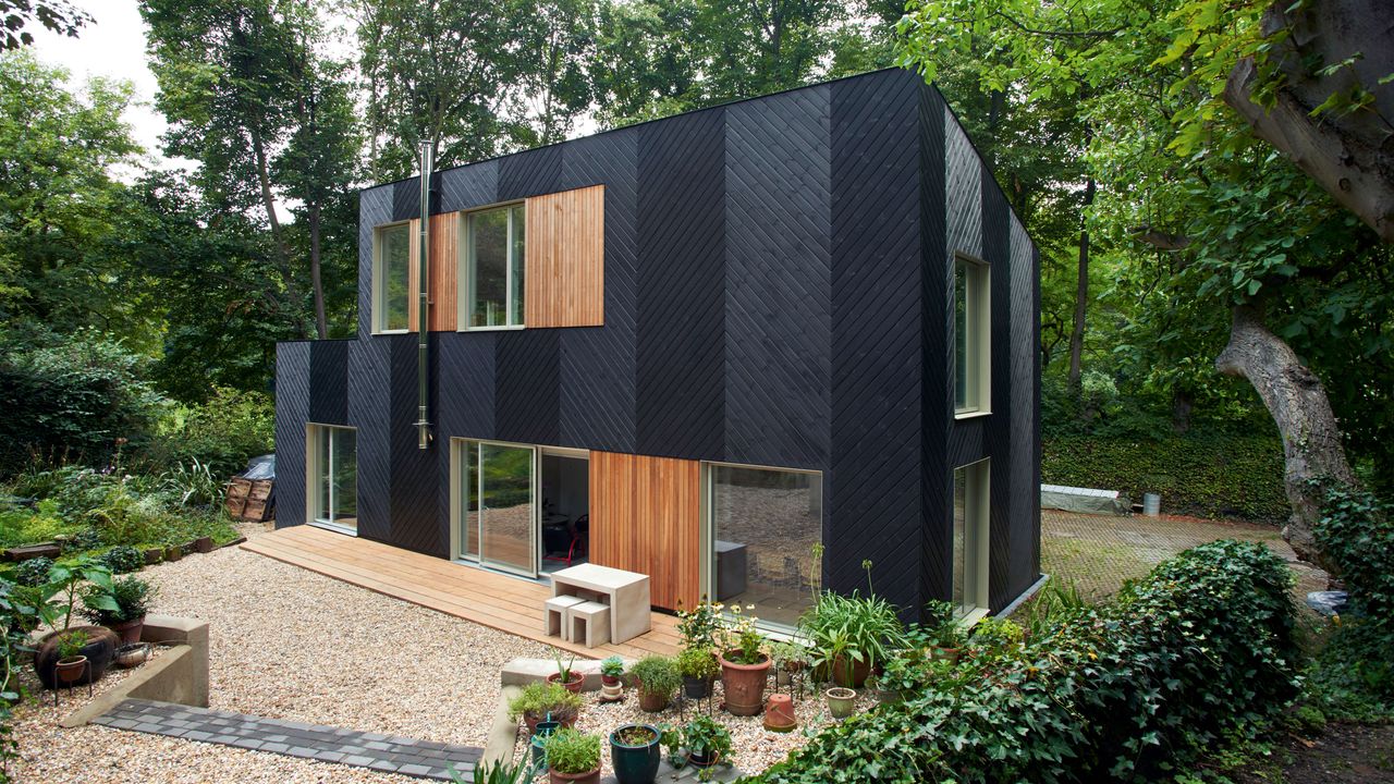 exterior of modern prefab home with black wooden panelling