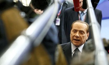 Italian Prime Minister Silvio Berlusconi is out and economists say the country's debt is way beyond what it can manage long-term.