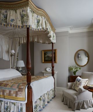 Neutral bedroom with a statement four poster bed