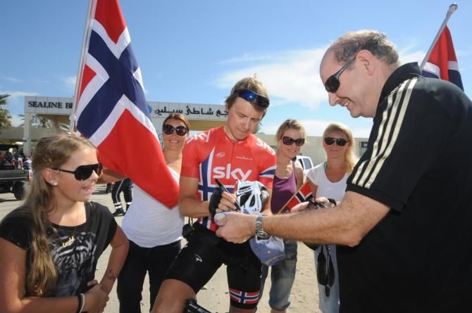 A Sky rider signs autographs