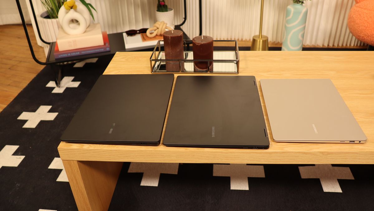 Three Samsung Galaxy Book3 sat next to each other on a wooden table