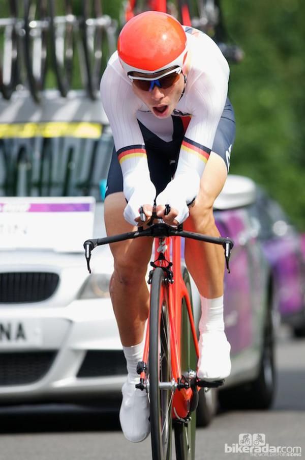 Tony Martin of Germany. A very aero position on his Specialized Shiv with McLaren helmet, extra grip tape on his bars, a taped on transponder, textured Bio Racer skinsuit and what looks like an older Zipp 808 front clincher. He didn't puncture this time and finished with the silver medal.