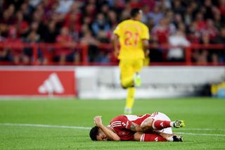 Brennan Johnson of Nottingham Forest reacts whilst holding his ankle after being fouled by Jack Robinson of Sheffield United (not pictured) during the Premier League match between Nottingham Forest and Sheffield United at City Ground on August 18, 2023 in Nottingham, England. (Photo by Harriet Lander/Getty Images)