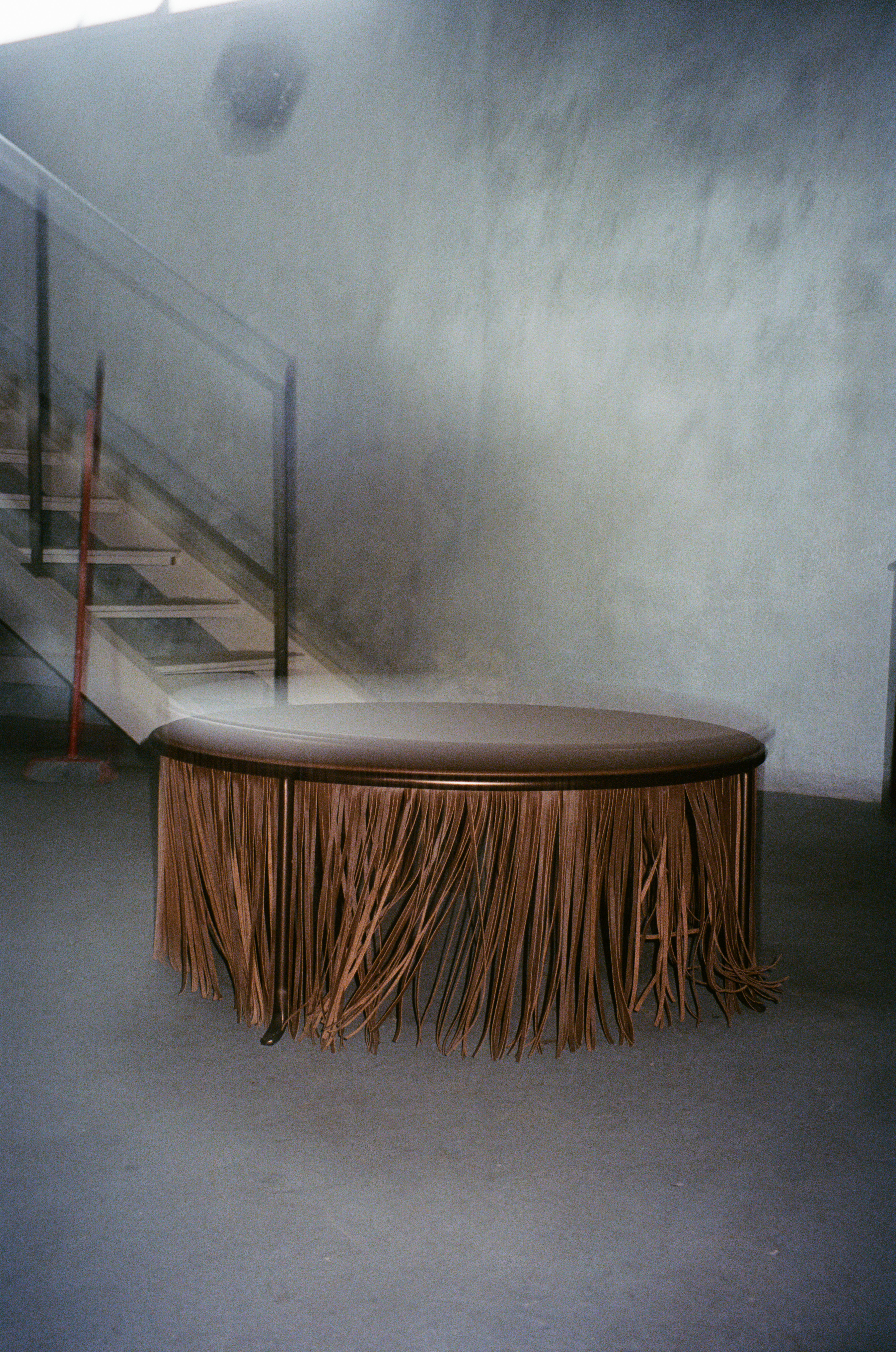 Dozie Kanu tables for Knoll with leather fringes