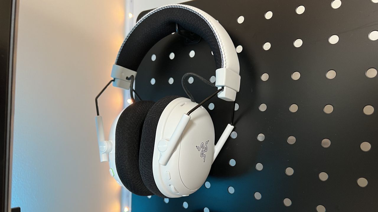 Razer BlackShark V3 Pro gaming headset hanging on a peg board