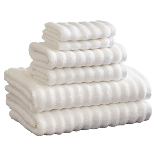 A set of ribbed white bath towels