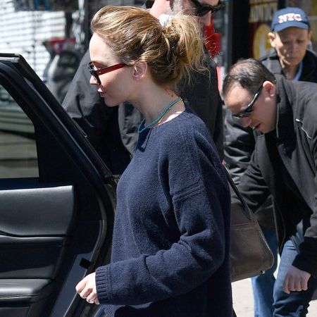 04/11/2026: Jennifer Lawrence and Cooke Maroney have a lunch date in New York City. Lawrence carried a black wool coat and wore a dark La Ligne sweater, white Balenciaga cargo pants, and yellow flats from The Row. The couple dined out at the famed ramen restaurant, Nakamura, in the Lower East Side.