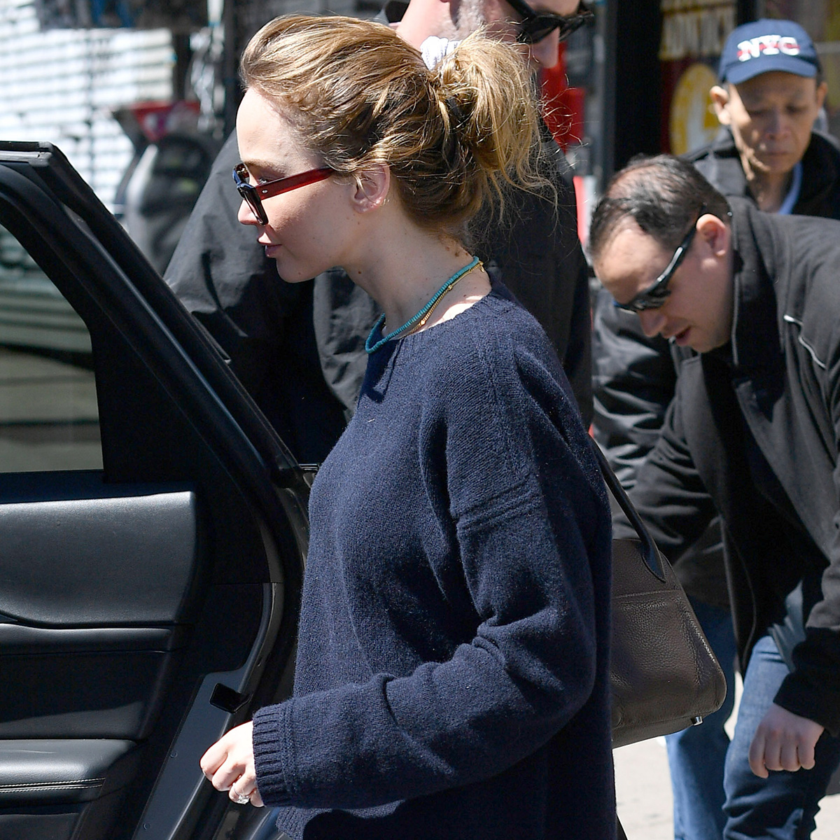 04/11/2026: Jennifer Lawrence and Cooke Maroney have a lunch date in New York City. Lawrence carried a black wool coat and wore a dark La Ligne sweater, white Balenciaga cargo pants, and yellow flats from The Row. The couple dined out at the famed ramen restaurant, Nakamura, in the Lower East Side.