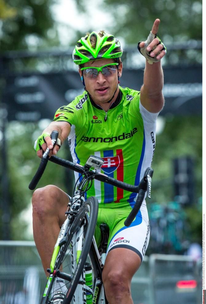 Peter Sagan (Cannondale) pops a one-handed wheelie to celebrate his win