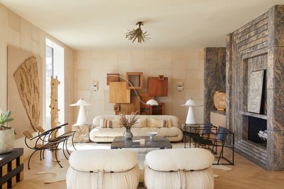 A symmetrical living room with curved sofas