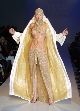 A model wears an outfit from the Bob Mackie fall 2001 collection on February 16, 2001 on the last day of Mercedes-Benz Fashion Week at Bryant Park in New York City.