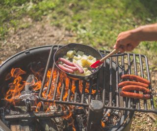 Cooking on a grill grate over a fire pit