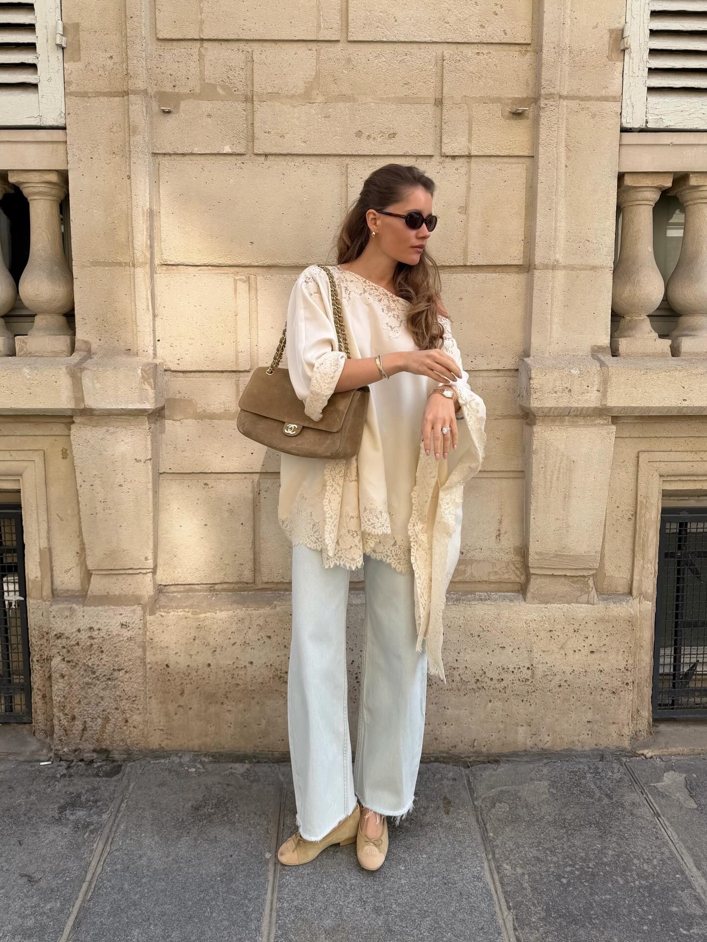 Woman wearing wide leg jeans with spring 2026 shoe trend.