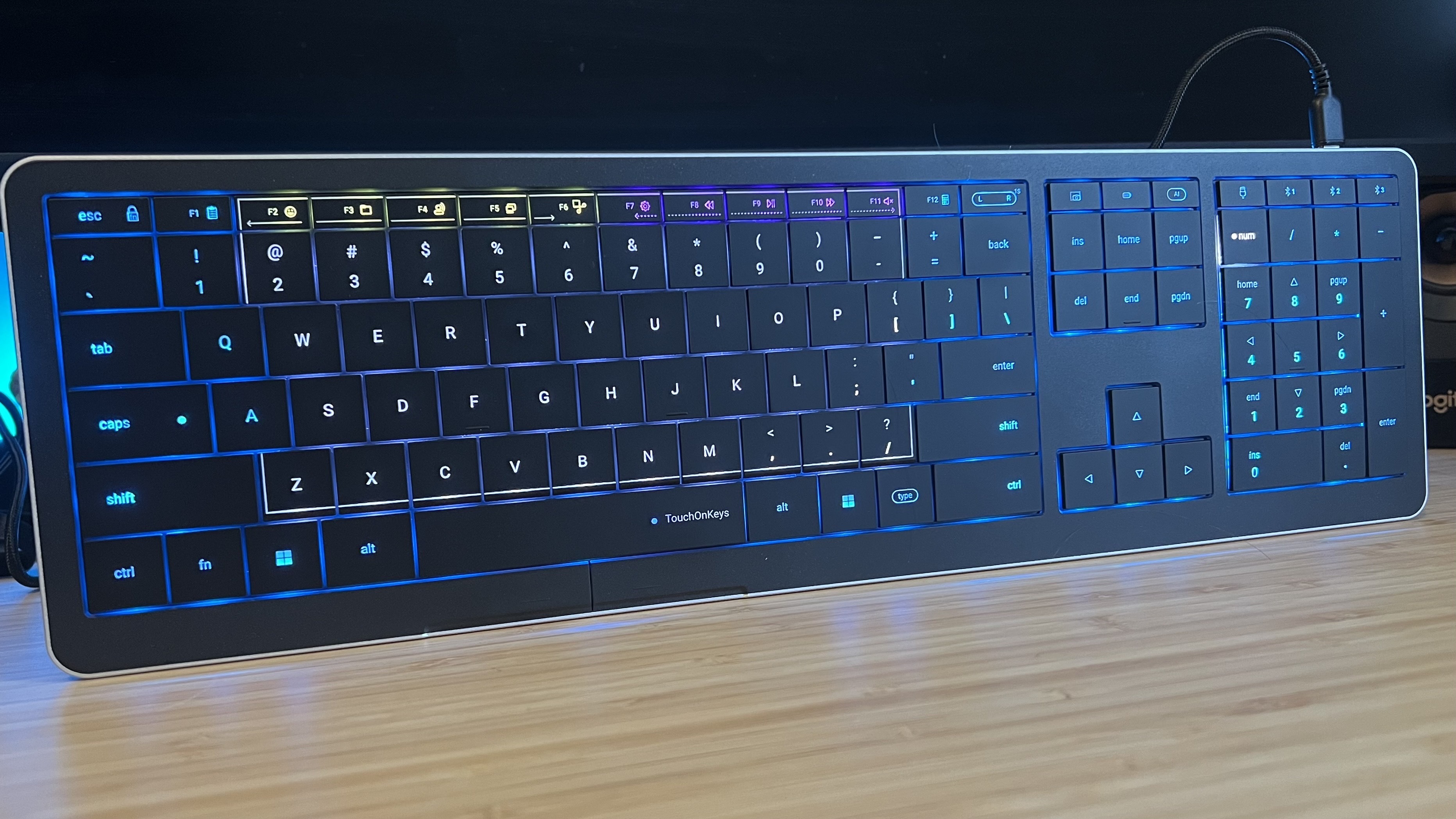 CLVX 1 keyboard on a wooden desk