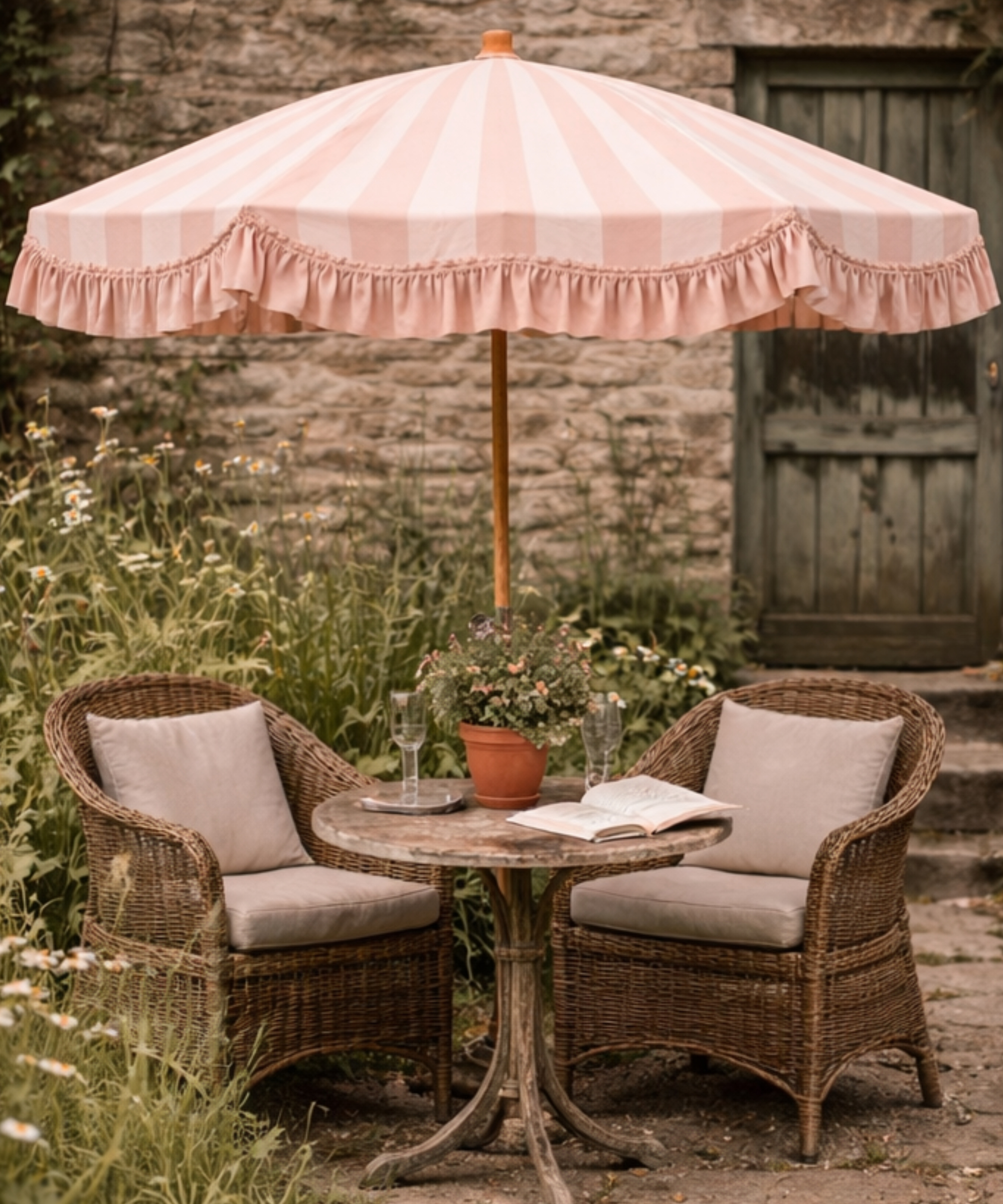 Bistro table set with a pink striped parasol