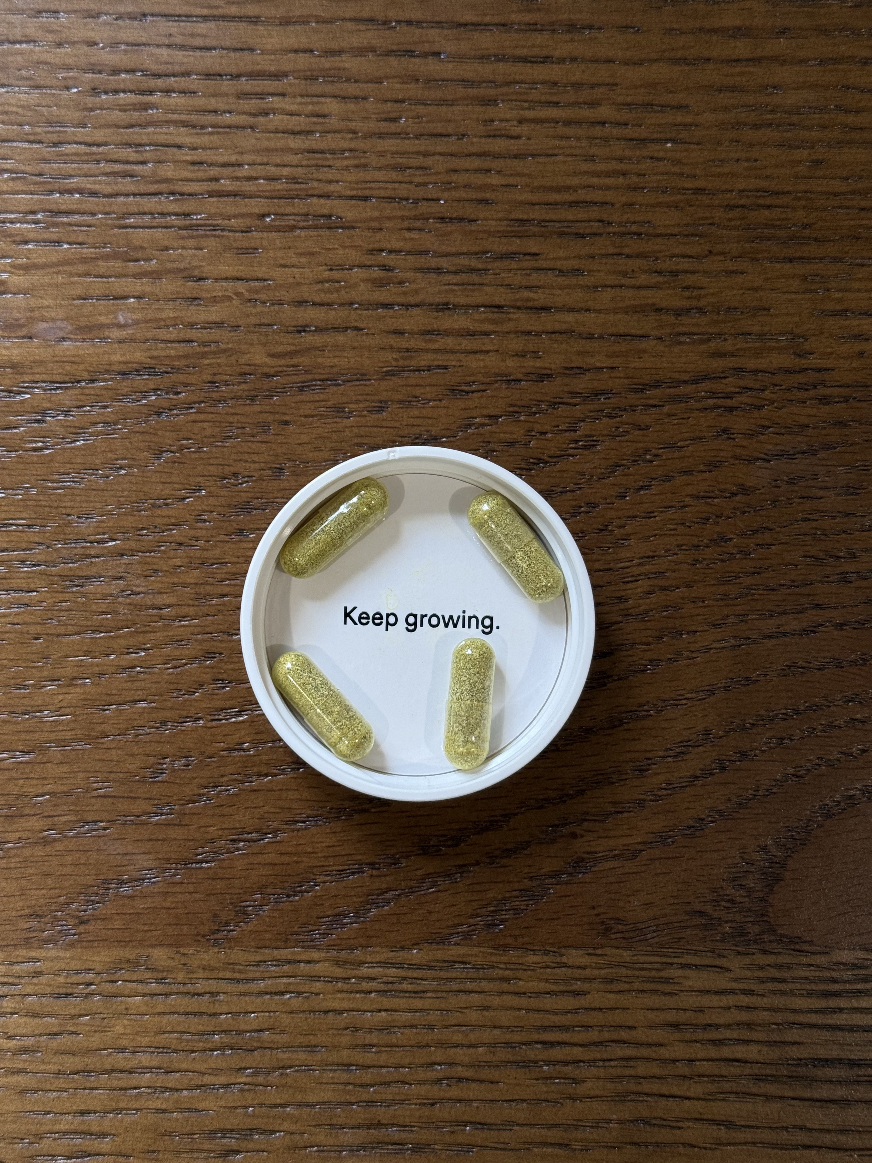 Nutrafol capsules on a table.