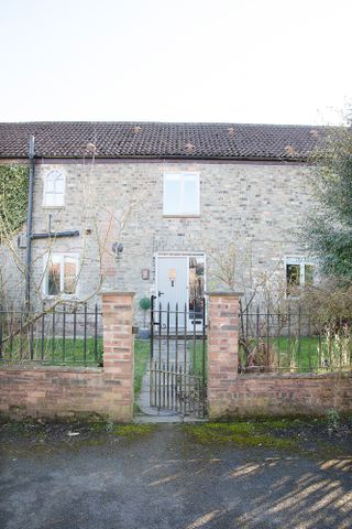 Hutchinson house: converted barn with grey front door