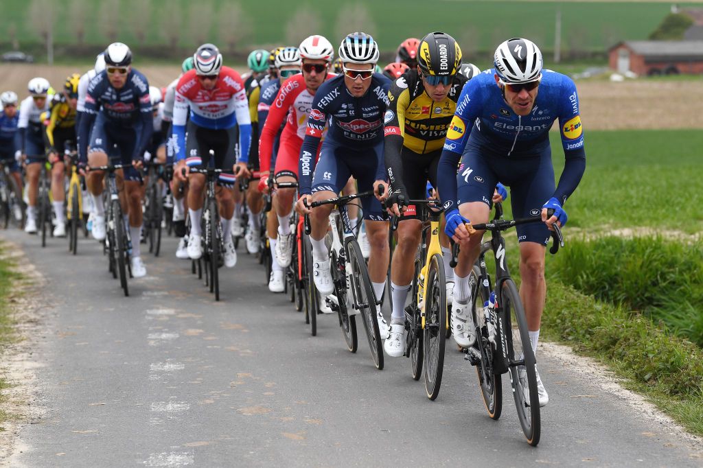 OUDENAARDE BELGIUM APRIL 04 Tim Declercq of Belgium and Team Deceuninck QuickStep Edoardo Affini of Italy and Team Jumbo Visma Silvan Dillier of Switzerland and Team AlpecinFenix The Peloton passing through Kortekeer during the 105th Ronde van Vlaanderen Tour of Flanders 2021 Mens Elite a 2515km race from Antwerp to Oudenaarde RVV21 rondevanvlaanderen tourofflanders on April 04 2021 in Oudenaarde Belgium Photo by Tim de WaeleGetty Images